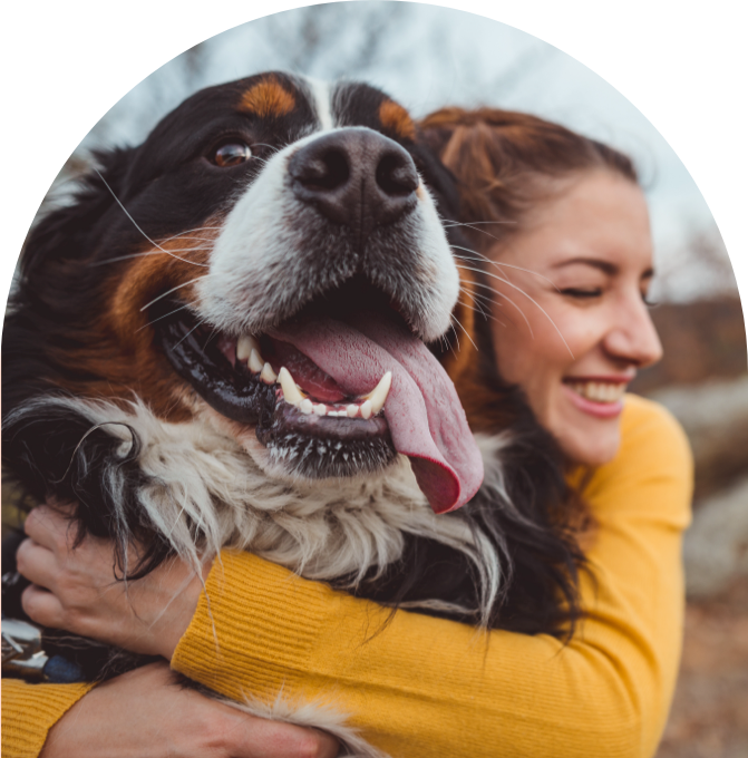 Photo of large dog and woman hugging